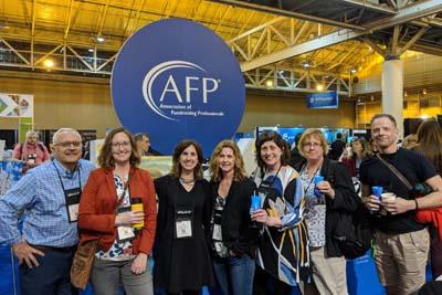 Group of Scholarship winners at AFP conference, breaking for a photo. 